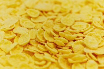 Breakfast concept - Close up of golden cornflakes