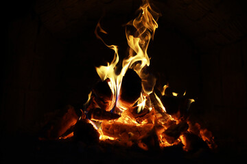 Background of the flame in the oven. Tongues of fire in a brick fireplace. Fire texture. - 751226515