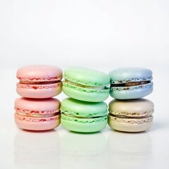 Obraz na płótnie Canvas pastel-colored macarons isolated on white background