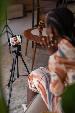 Black female blogger discussing jewelry on blog