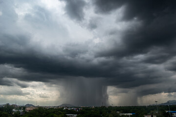 A stormy sky with a large rain cloud