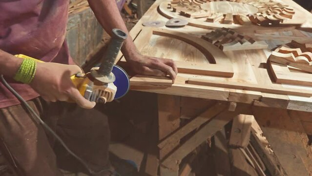 Artisan woodworking in a workshop crafting decorative objects with tools and skill