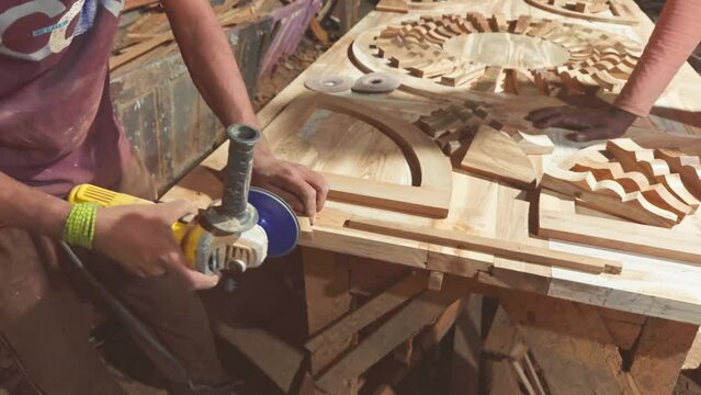Artisan woodworking in a workshop crafting decorative objects with tools and skill