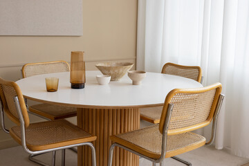 A modern dining room with stylish furniture