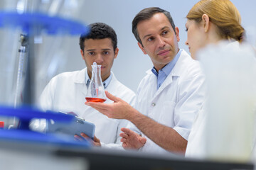 Fototapeta premium a lab worker with students