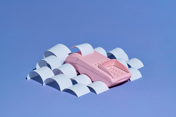 Payment terminal with cash tape on color backgroun