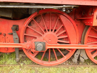Close-up of a steam locomotive wheel.
