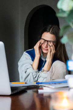 Remote Fatigue: Young woman exhausted after extended online work 