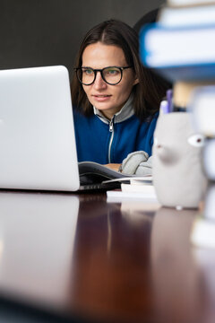 A young woman working online at home office. 