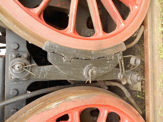 Close-up of a steam locomotive wheel.