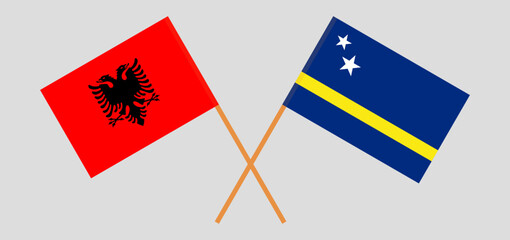 Crossed flags of Albania and Country of Curacao. Official colors. Correct proportion