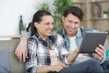 Fototapeta premium happy couple video chatting on tablet