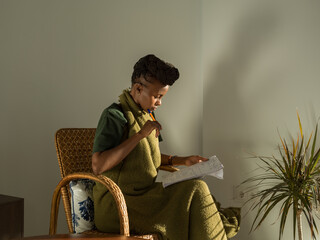 Smart woman learning foreign words in living room