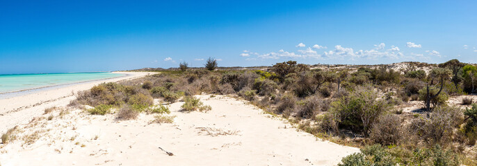 white sand dunes and blue sea in Mamirano bay, Tulear. Madagascar
