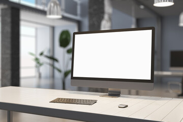 Fototapeta premium Creative designer desktop with empty white mock up computer display, supplies and blurry office interior in the background. 3D Rendering.
