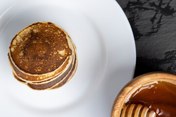 delicious homemade hot pancakes with honey