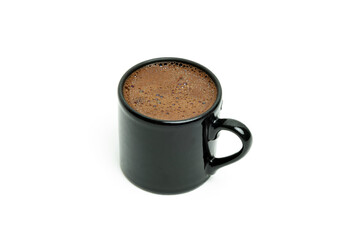 Turkish coffee in black cup on white background