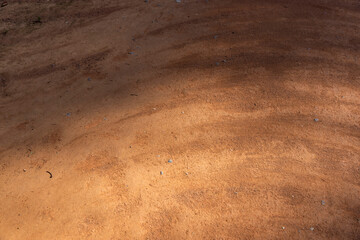 a walking red path made of rammed sand after sweeping