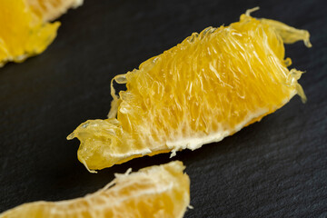 peeled slices of ripe and juicy orange close-up - 751253140