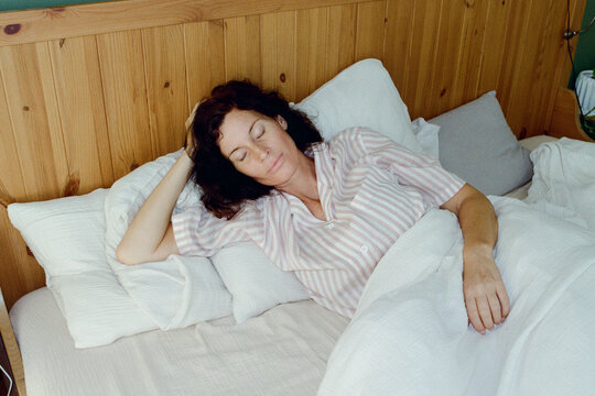 A woman resting in a bed