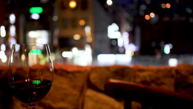 Wine Glass Against City Lights