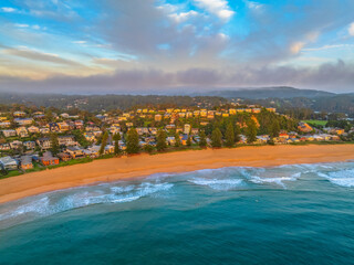 Fototapeta premium Aerial views of sunrise by the sea with clouds