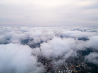 Fototapeta premium Aerial View of Clouds From Airplane