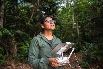 Woman flying drone in nature