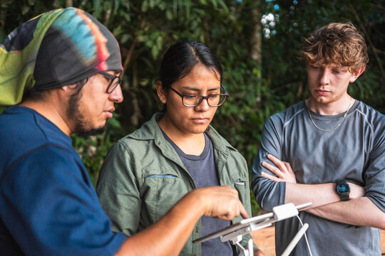 People flying drone in nature