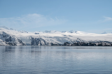 Snow Covered Glacier above College Fjord on a bright sunny day, Alaska, USA