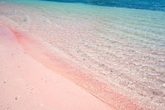Tropical pink sandy beach with clear turquoise water at Komodo islands in Indonesia