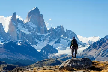 Foto op Plexiglas The rugged peaks of Patagonia rising majestically against a clear sky, with an adventurer gazing at the view © Lemar