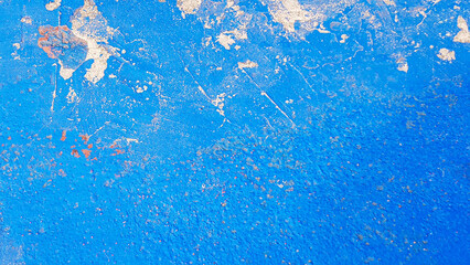 Texture of blue shabby wall with uneven surface and lack of paint in some places. A banner with space for text. High quality photo