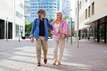 Beautiful happy senior couple bonding outdoors - Cheerful old people romantic dating in the city,...