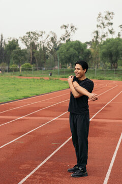 Latino man exercising in the park.