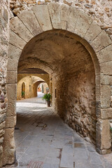 Arcades. Medieval village of Monells. Girona, Costa Brava. Catalunya. Spain