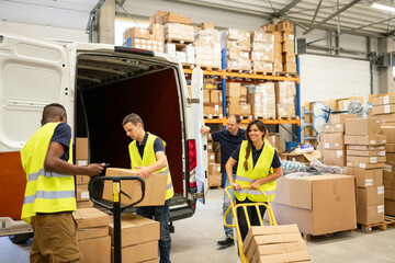 Logistic Workers Unloading Delivery Van While Driver Waiting