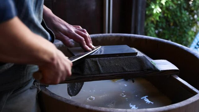 Sharpening Knife on Water Stone