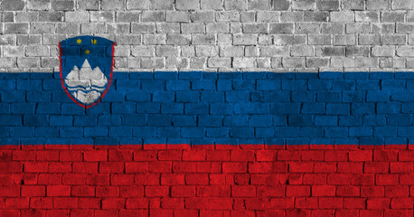 Republic of Slovenia Flag Over a Grunge Brick Background