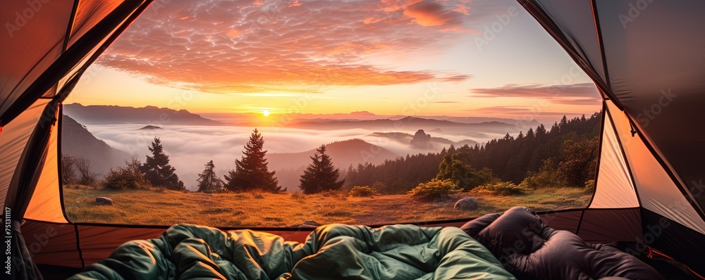 Wall mural view of the serene landscape from inside a tent. camping at campsite with sleeping bags. stunning su - Wall murals