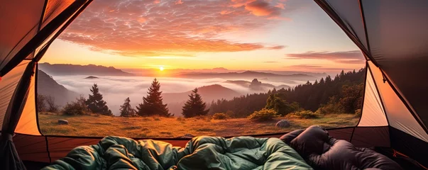 Foto op Canvas View of the serene landscape from inside a tent. Camping at campsite with sleeping bags. Stunning sunrise © Coosh448
