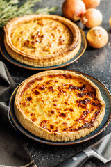 Traditional french pie. Quiche lorraine on kitchen table.
