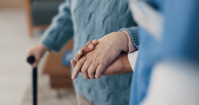 Holding hands, help with elderly person and caregiver in nursing home, kindness and senior care for health. Retirement, pension and patient with disability, nurse for assistance and homecare closeup