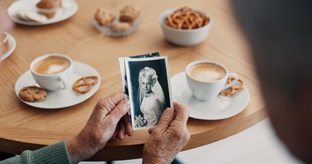 Senior people, hands and photograph memory in home for nostalgia, history and to remember. Breakfast, elderly friends and pov at tea table with pictures of album, wedding or photography in retirement - obrazy, fototapety, plakaty
