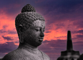 Budha head. Sunset at Borobudur temple Java Indonesia in the eighties. 