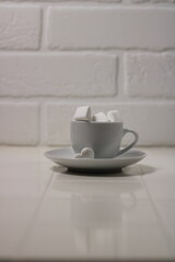marshmallows are white in a white mug on a white background