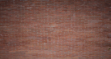 Texture of the wall of thin long red bricks. Brick background of old wall