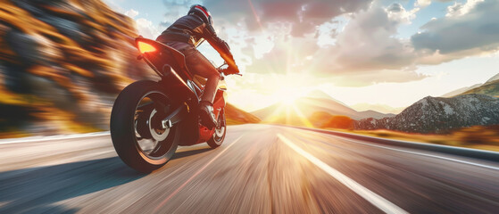 Motorcyclist speeding down the highway towards the sunset.