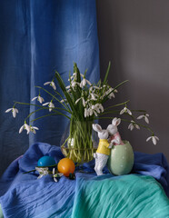 A still life arrangement of Easter eggs, spring flowers. Still life with snowdrops and ester eags. - 751329542