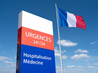 Un panneau de signalisation d'urgences médicales 24 heures sur 24 avec un drapeau français - 751330713